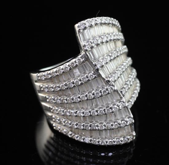 A stylish modern 18ct white gold and diamond encrusted dress ring, size P.